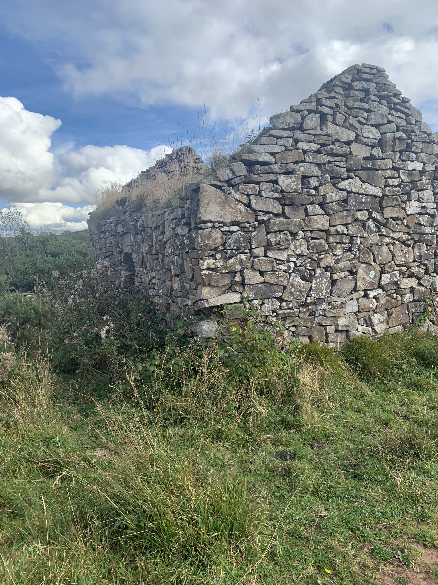 Stone
                  house on trail